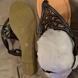 BRAND NEW black sandals. Not sure of brand